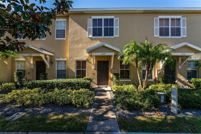 13228 Daniels Landing Cir, Winter Garden, FL 34787 - townhome / multi-family property featuring stucco siding
