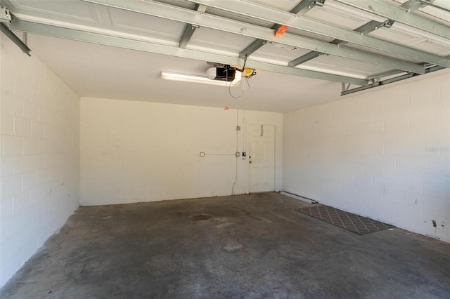 13228 Daniels Landing Cir, Winter Garden, FL 34787 - garage featuring a garage door opener and concrete block wall