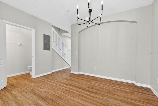 13228 Daniels Landing Cir, Winter Garden, FL 34787 - unfurnished dining area with electric panel, stairs, a chandelier, and light wood finished floors