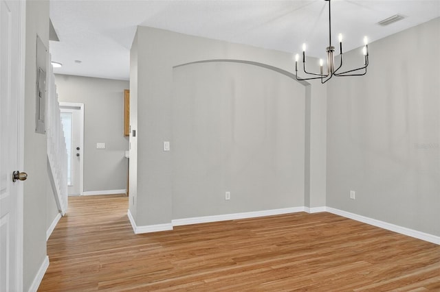 13228 Daniels Landing Cir, Winter Garden, FL 34787 - unfurnished room featuring light wood-type flooring and a chandelier