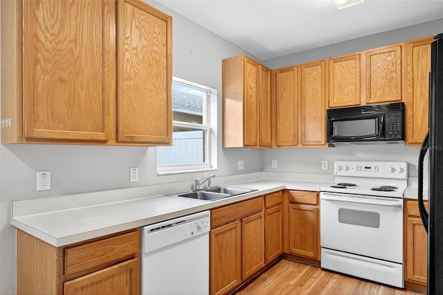 13228 Daniels Landing Cir, Winter Garden, FL 34787 - kitchen featuring white appliances, light wood finished floors, and light countertops