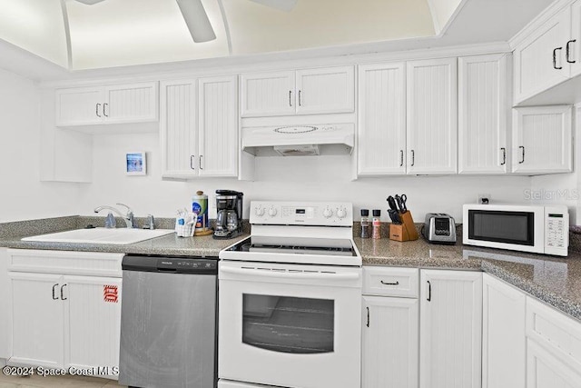 kitchen with white cabinets, white appliances, sink, and custom exhaust hood