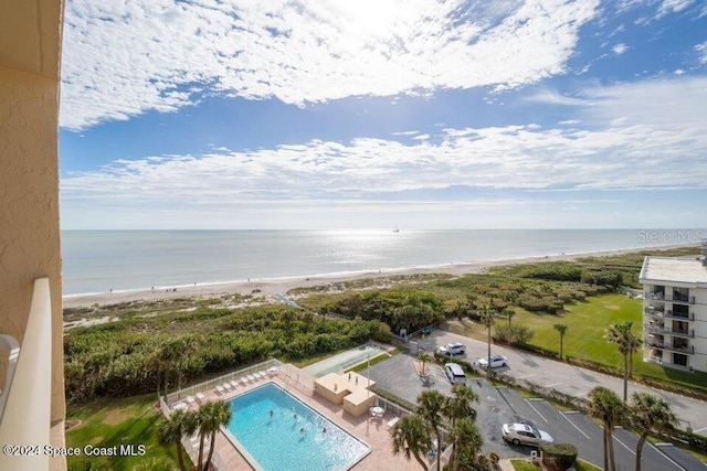 birds eye view of property featuring a view of the beach and a water view