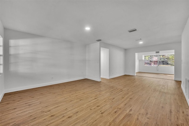990 Sunrise Dr, Tarpon Springs, FL 34689 - unfurnished room with light wood-style flooring, baseboards, and recessed lighting