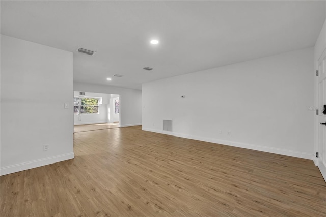 empty room with light hardwood / wood-style flooring