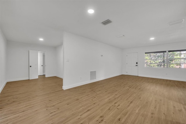 empty room with light hardwood / wood-style floors