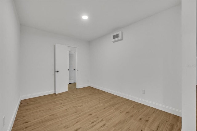 990 Sunrise Dr, Tarpon Springs, FL 34689 - empty room with light wood-style flooring, baseboards, and recessed lighting