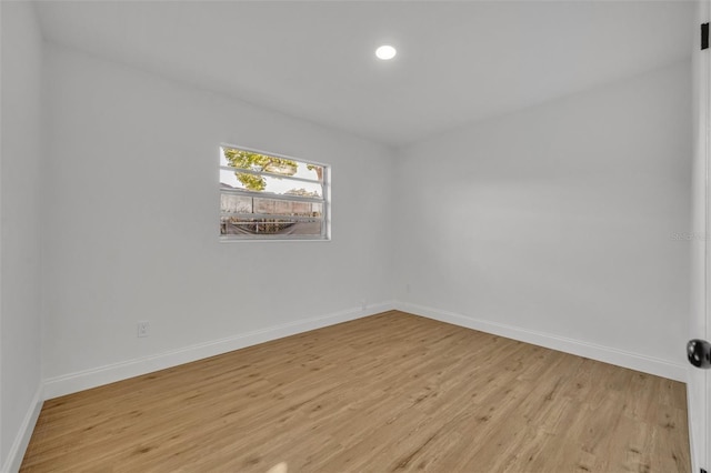 unfurnished room with light hardwood / wood-style floors