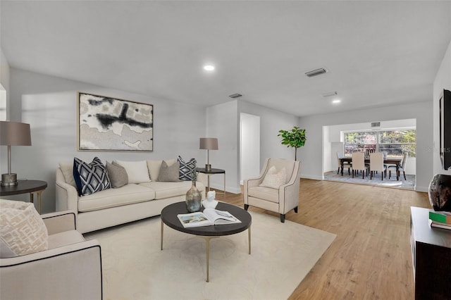 living room with light hardwood / wood-style floors