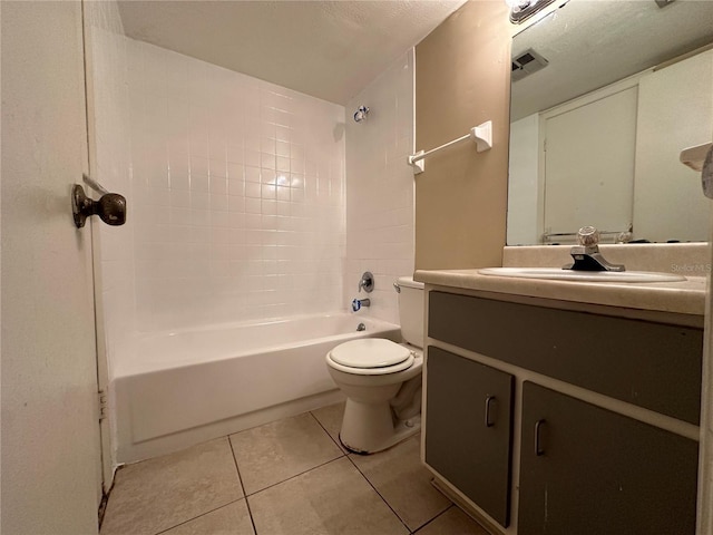 full bathroom with toilet, vanity, tiled shower / bath combo, and tile patterned floors