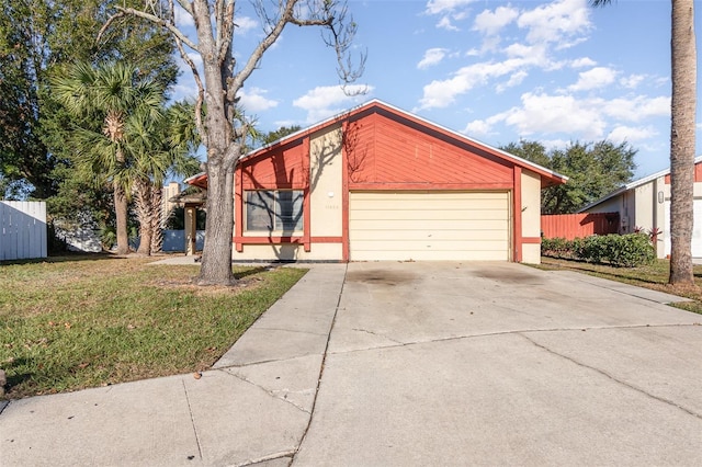 view of front of home with a garage and a front lawn