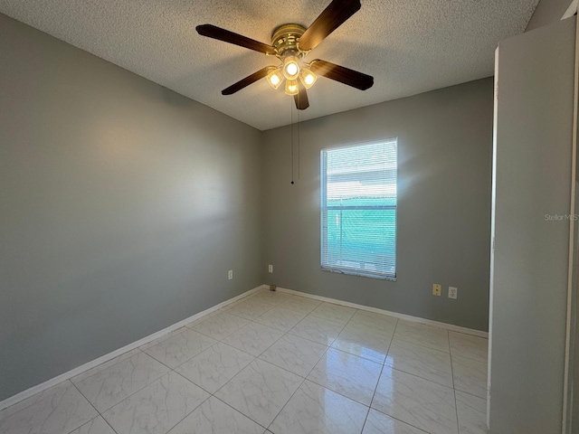 unfurnished room featuring a textured ceiling and ceiling fan