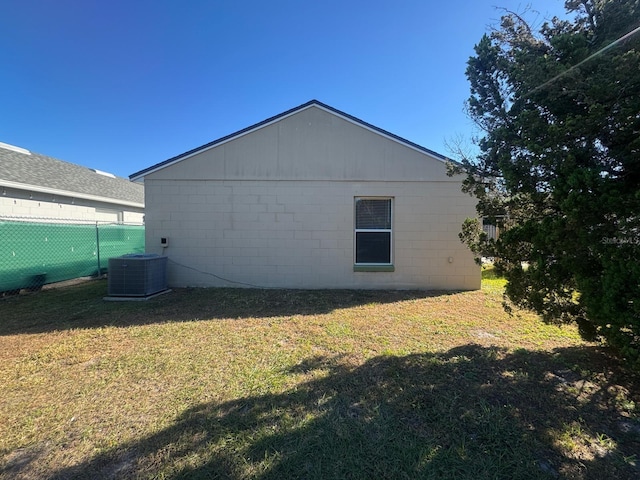 view of property exterior featuring a yard and cooling unit