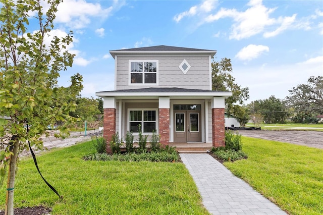 view of front of home featuring a porch and a front yard