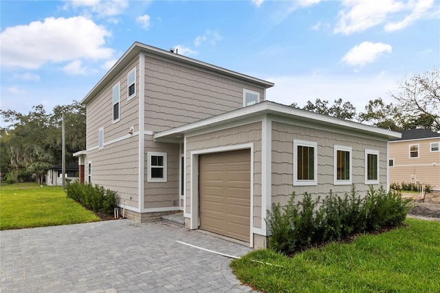 view of side of home with a yard