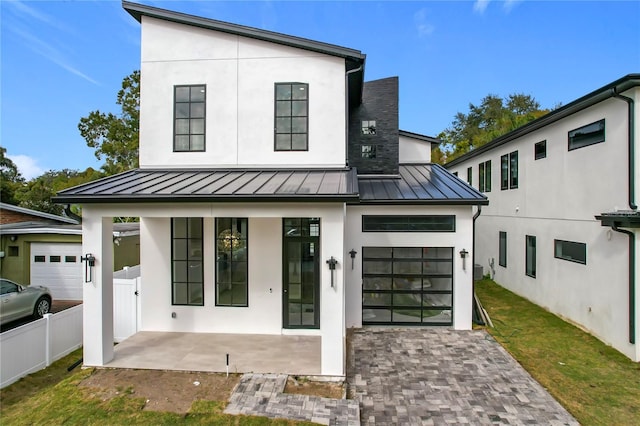 view of front of property with a garage