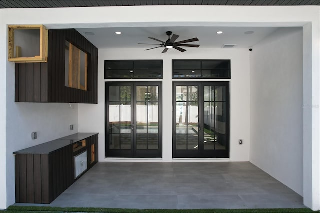 interior space featuring ceiling fan and french doors