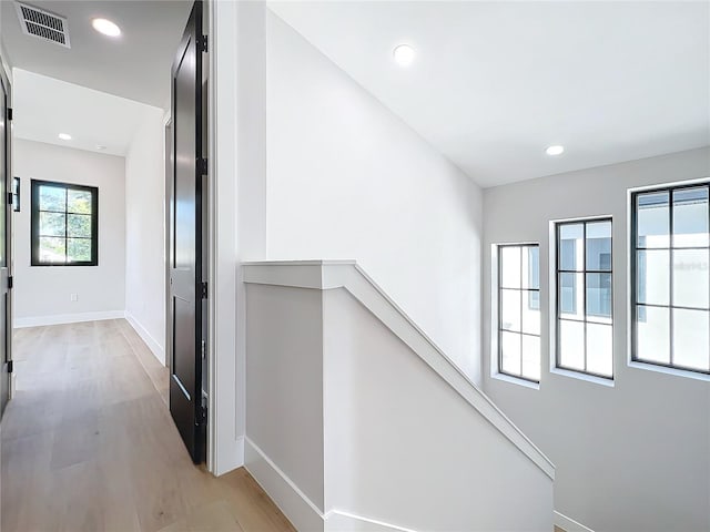 hallway with light wood-type flooring