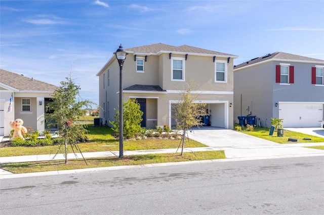 view of front of house featuring cooling unit, a garage, and a front lawn