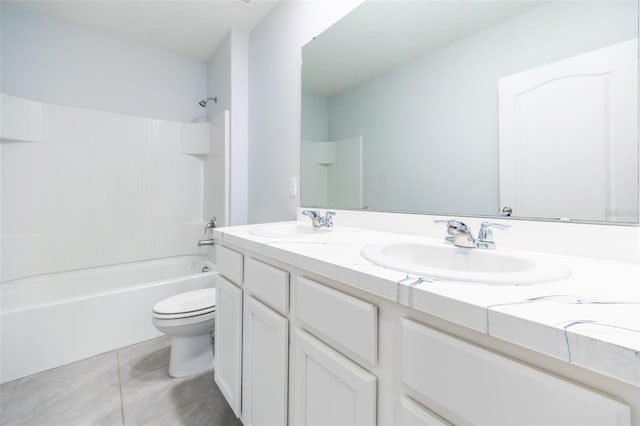 full bathroom featuring tile patterned floors, vanity, toilet, and shower / tub combination