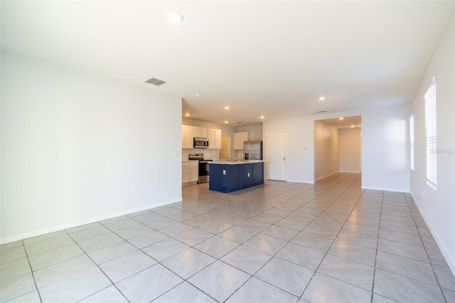 unfurnished living room featuring light tile patterned floors