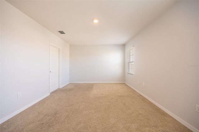 view of carpeted spare room