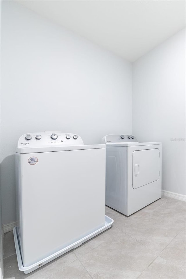 laundry room with separate washer and dryer