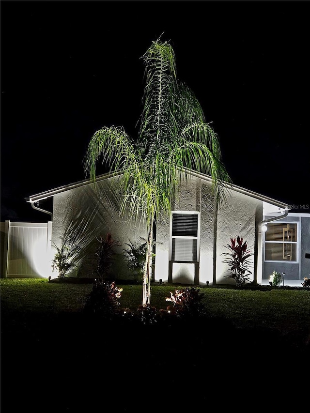 view of property exterior at night