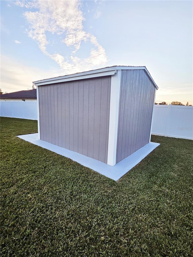 outdoor structure at dusk with a lawn