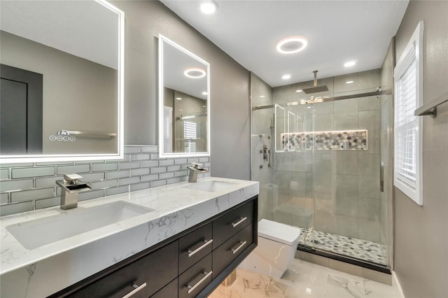 bathroom with vanity, tasteful backsplash, toilet, and an enclosed shower