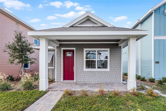 property entrance featuring covered porch