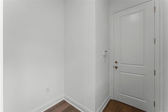 entryway with dark hardwood / wood-style flooring