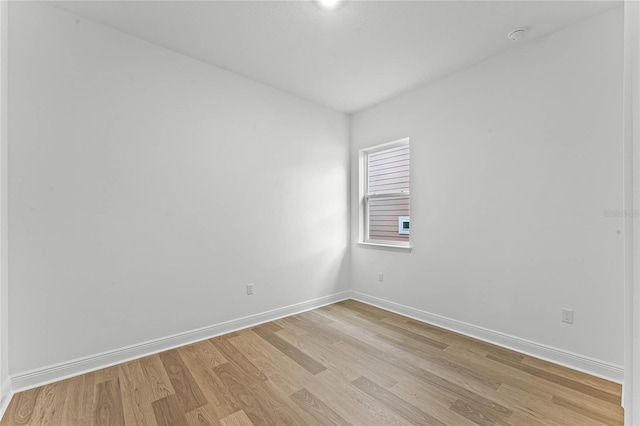 empty room with light hardwood / wood-style floors