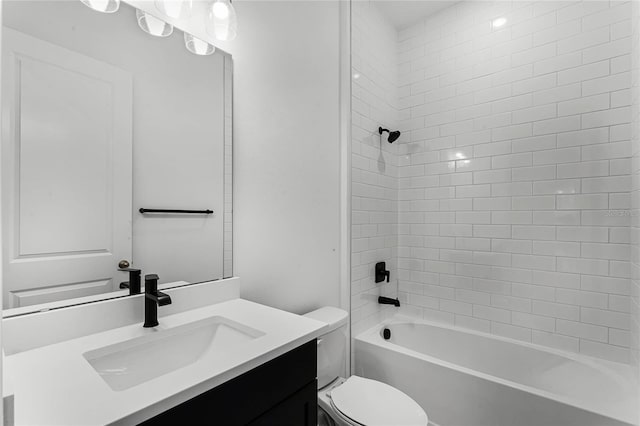 full bathroom with tiled shower / bath combo, toilet, and vanity