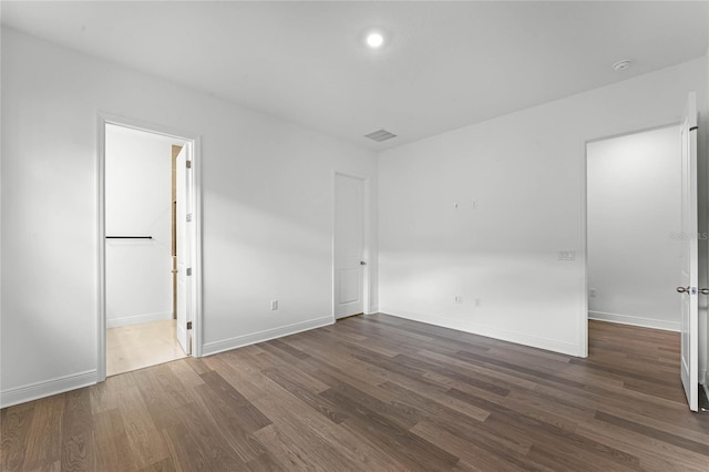 empty room featuring dark wood-type flooring