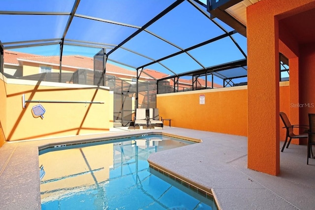 view of pool featuring a lanai and a patio