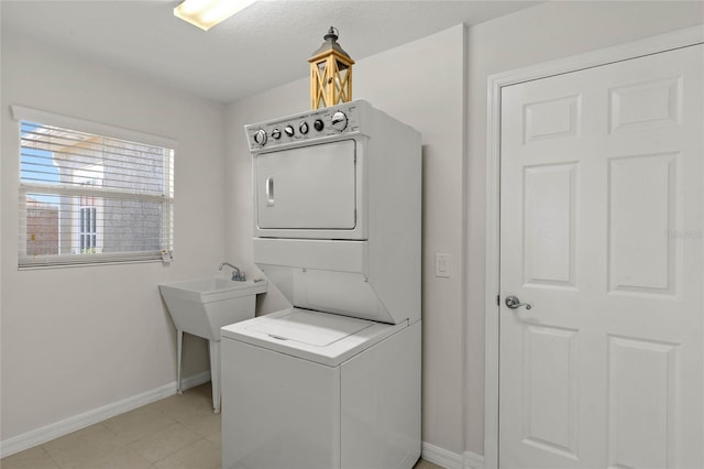 laundry area with stacked washer and dryer