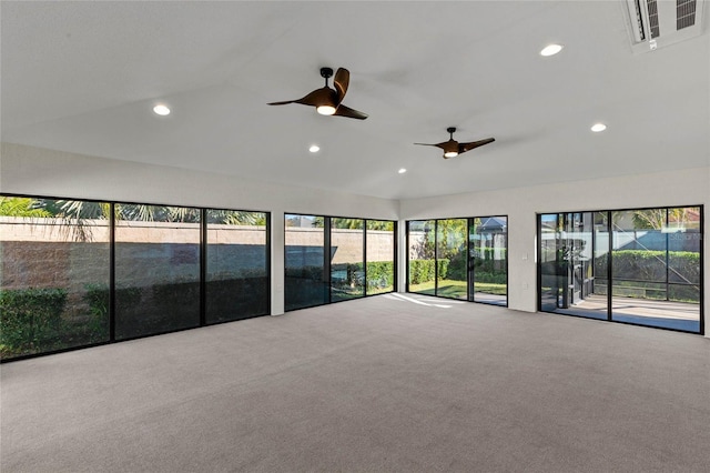 unfurnished room with ceiling fan, lofted ceiling, and carpet floors