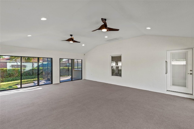 carpeted empty room featuring ceiling fan and lofted ceiling