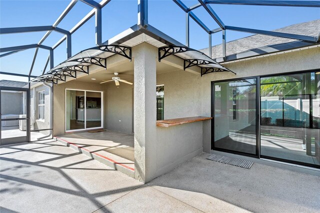 exterior space featuring ceiling fan and a patio area