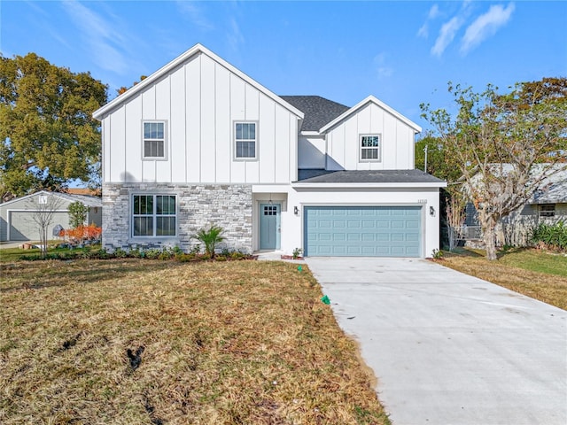 view of front of house featuring a front yard and a garage