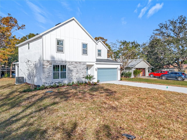 view of front of home with a garage, central air condition unit, and a front lawn