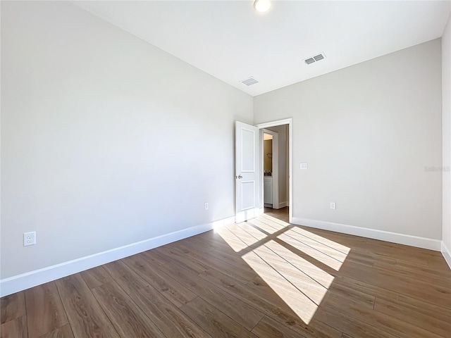 empty room with wood-type flooring