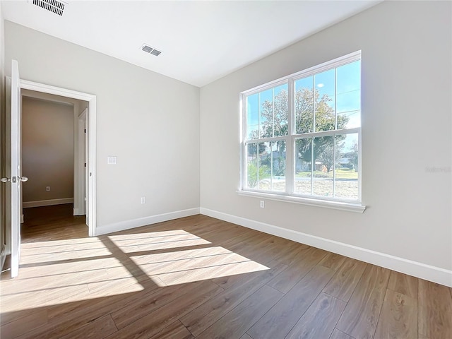 unfurnished room featuring wood-type flooring