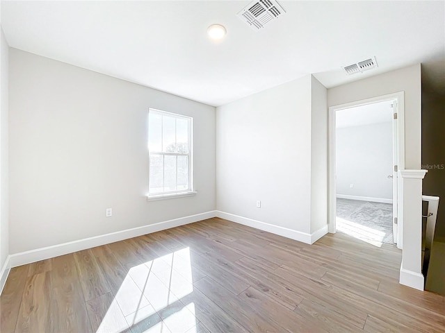 unfurnished room featuring light wood-type flooring