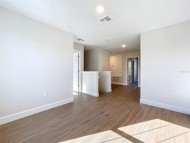 unfurnished room featuring hardwood / wood-style flooring