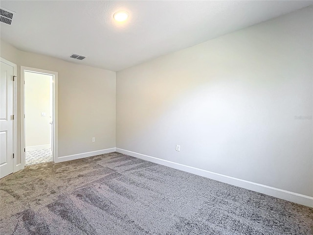 empty room featuring carpet flooring