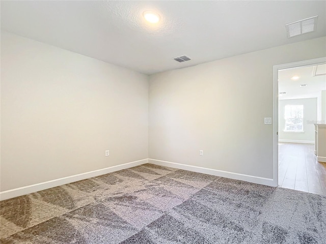 spare room featuring hardwood / wood-style flooring