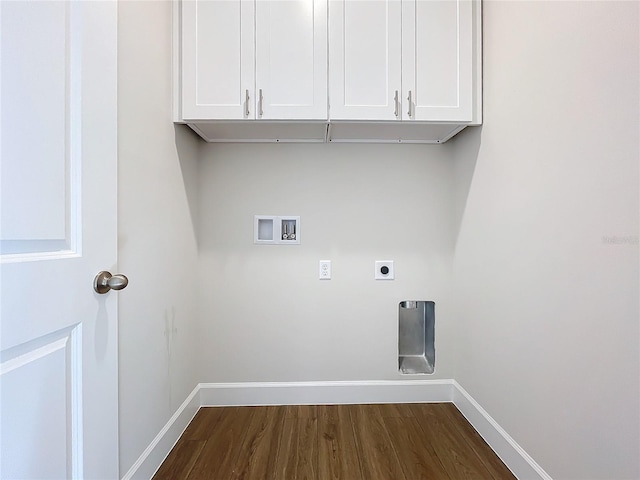 clothes washing area with hookup for an electric dryer, hookup for a washing machine, dark hardwood / wood-style flooring, and cabinets