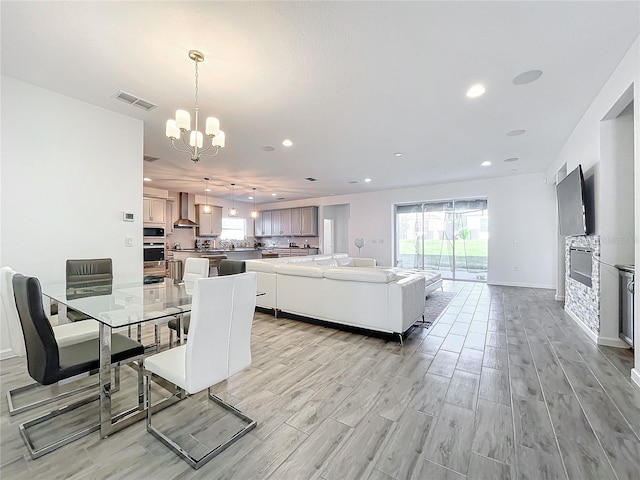 4408 Renly Ln, Clermont, FL 34711 - dining area with a chandelier, light wood-style flooring, and recessed lighting